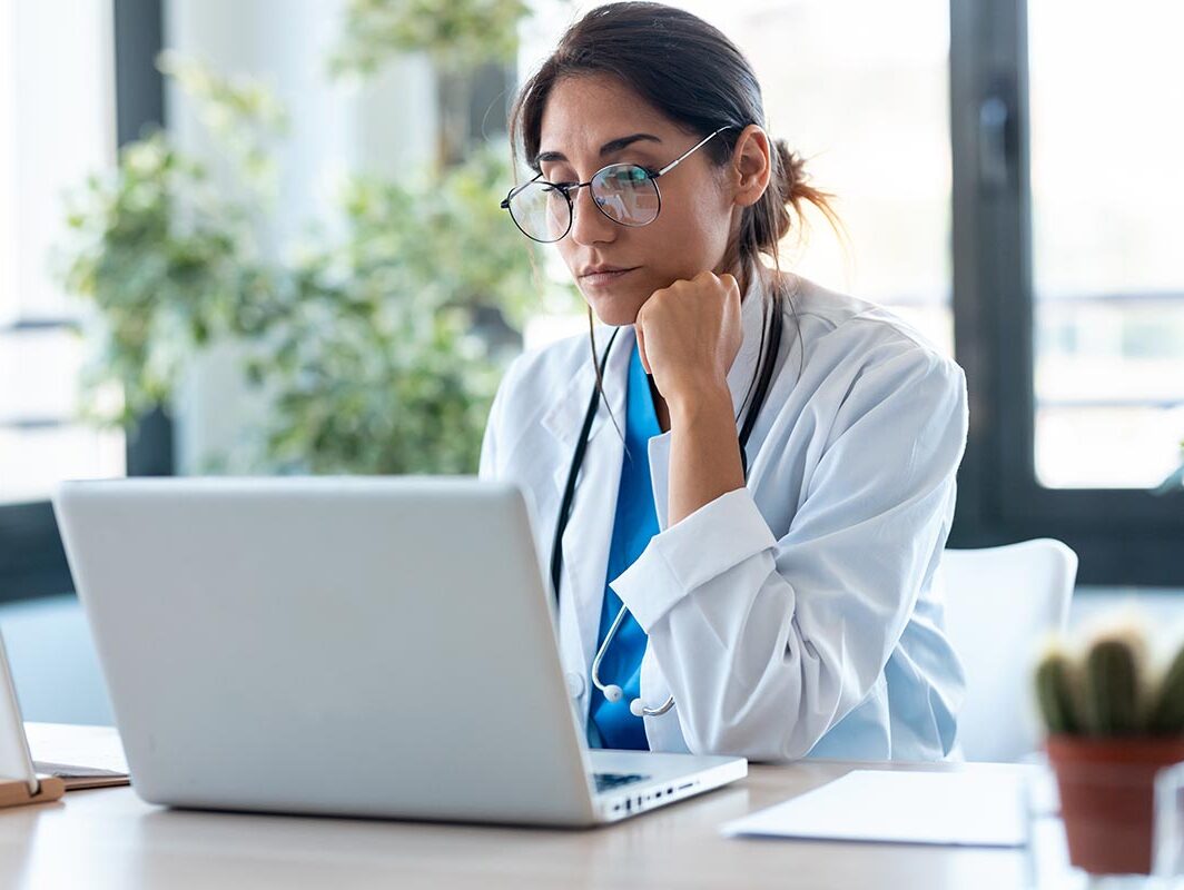 Doctor at her laptop.